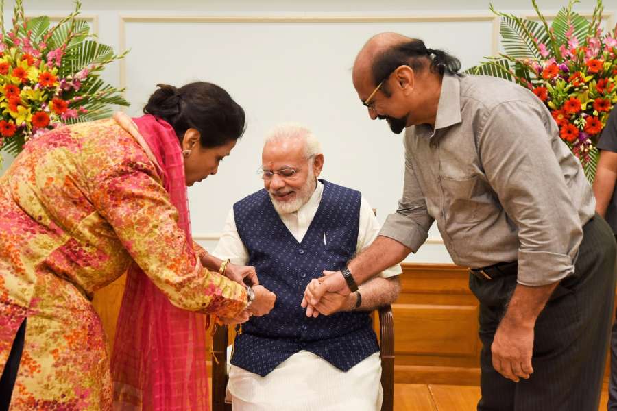 New Delhi: A woman ties 'Rakhi' on Prime Minister Narendra Modi’s wrist, on Raksha Bandhan, in New Delhi on Aug 7, 2017. (Photo: IANS/PIB) by .