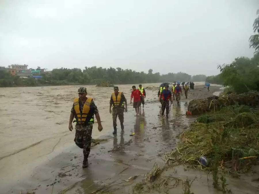 BIRATNAGAR, Aug. 12, 2017 (Xinhua) -- Rescuers evacuate resients suffered from flood in Biratnagar, Nepal, on Aug. 12, 2017. Monsoon-induced floods have created havoc across the low-lying areas known as Terai region in Nepal since Friday night. (Xinhua/IANS) by .