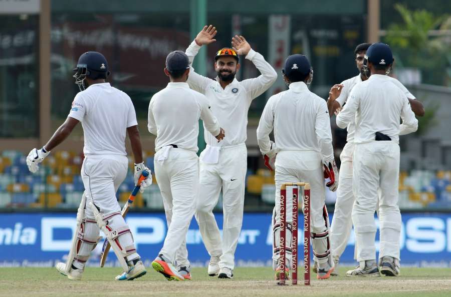 Colombo: Indian skipper Virat Kohli along with the teammates celebrates fall of Dimuth Karunaratne on Day 2 of the second test match between India and Sri Lanka at Sinhalese Sports Club Ground in Colombo, Sri Lanka on Aug 4, 2017. (Photo: Surjeet Yadav/IANS) by .