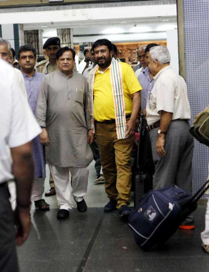Ahmedabad: Ahmed Patel, political aide to the Congress president Sonia Gandhi arrives in Ahmedabad along with party MLAs from Gujarat, who were camping at a resort on the outskirts of Bengaluru in party-ruled Karnataka for the past nine days; at Sardar Vallabhbhai Patel International Airport on Aug 7, 2017. Gujarat Congress MLAs were in Bengaluru since July 29 to prevent their possible poaching by the ruling BJP for the Rajya Sabha election where the Congress is attempting to get Ahmed Patel, the political aide to party president Sonia Gandhi, re-elected. (Photo: IANS) by .