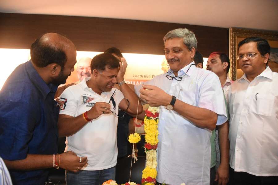 Panaji: Goa Chief Minister Manohar Parrikar and Health Minister Vishwajit Rane celebrating after wining the Panaji and Valpoi bypolls in Panaji on Aug. 28, 2017. (Photo: IANS) by .