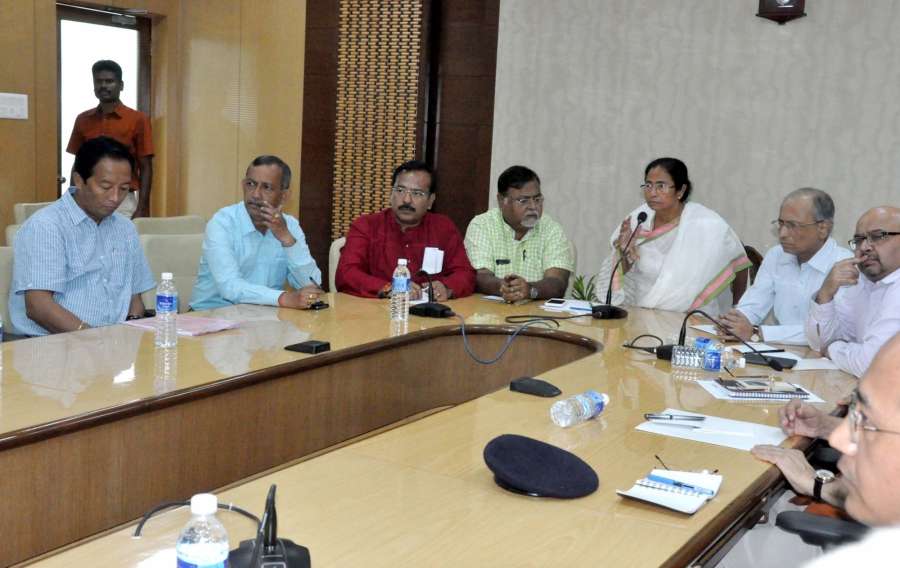 Howrah: West Bengal Chief Minister Mamata Banerjee and Gorkha Janamukti Morcha (GJM) joint secretary Binay Tamang along with other representatives during a meeting on Darjeeling issue at Nabanna in Howrah on Aug 29, 2017. (Photo: IANS) by .