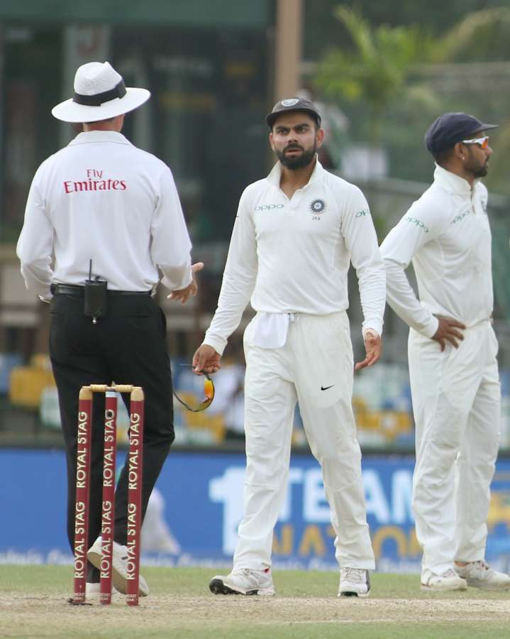 Colombo: Indian skipper Virat Kohli interacts with umpire after appalling for review of Sri Lanka's batsman Kusal Mendis on Day 2 of the second test match between India and Sri Lanka at Sinhalese Sports Club Ground in Colombo, Sri Lanka on Aug 4, 2017. (Photo: Surjeet Yadav/IANS)​ by .