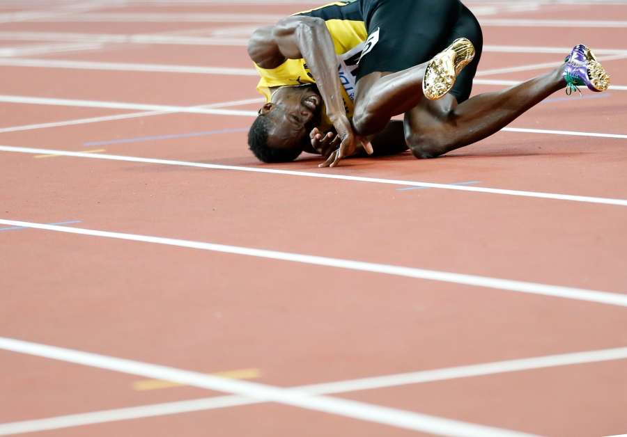 LONDON, Aug. 13, 2017 (Xinhua) -- Usain Bolt of Jamaica falls down as he walks to the finish line during Men's 4x100m Relay Final on Day 9 of the 2017 IAAF World Championships at London Stadium in London, Britain, on Aug. 12, 2017. (Xinhua/Wang Lili/IANS) by .