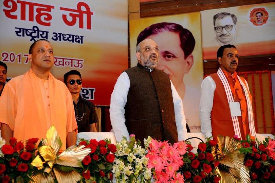 Lucknow: BJP chief Amit Shah during a party programme in Lucknow on July 29, 2017. Also seen Uttar Pradesh Chief Minister Yogi Adityanath and Deputy Chief Minister Keshav Prasad Maurya (Photo: IANS) by .