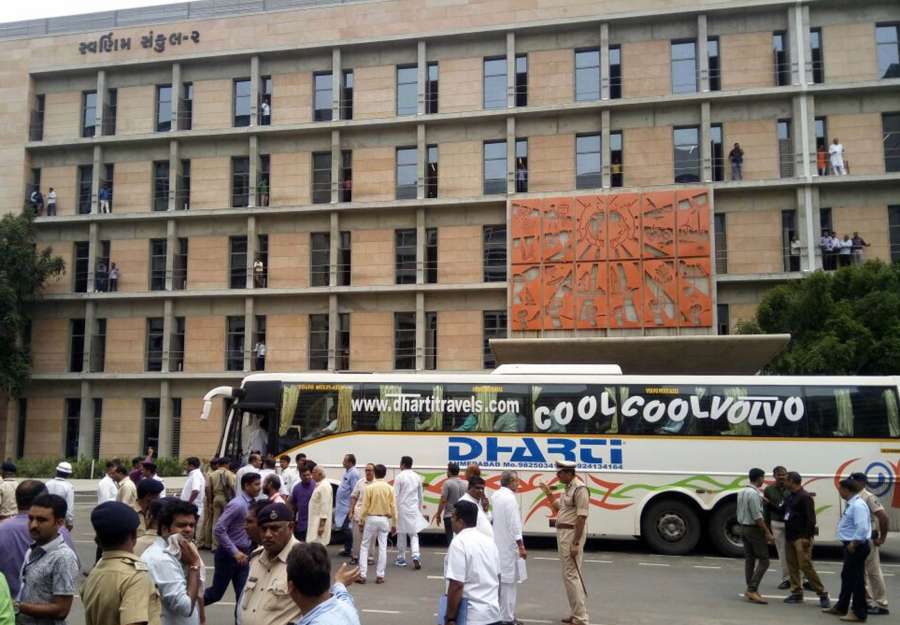 Gandhinagar: The 44 Congress legislators who were kept at a resort in Karnataka arrive to exercise their franchise during poll for three crucial Rajya Sabha seats in Gandhinagar of Gujarat on Aug 8, 2017. (Photo: IANS) by .