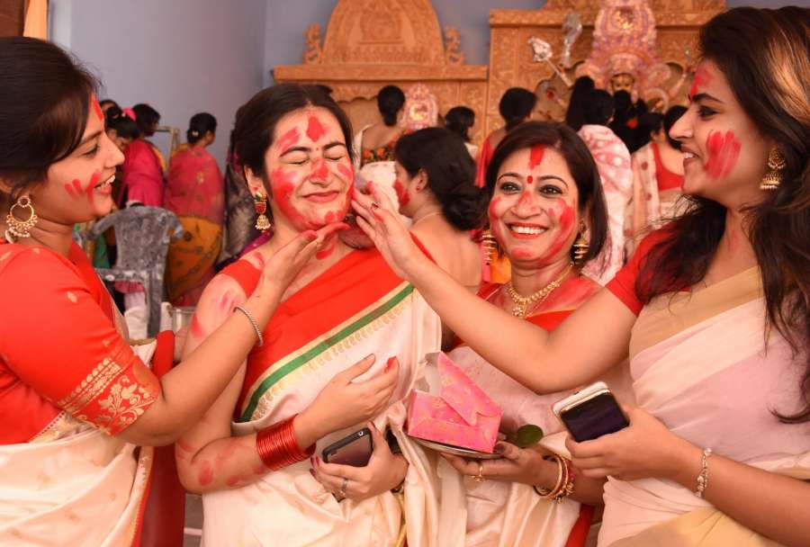 Lucknow: Woman participate in Sindoor Khela - a ritual in which married woman apply vermilion to goddess Durga and thereafter to each other on the last day of Durga Puja - in Lucknow on Sept 30, 2017. (Photo: IANS) by .