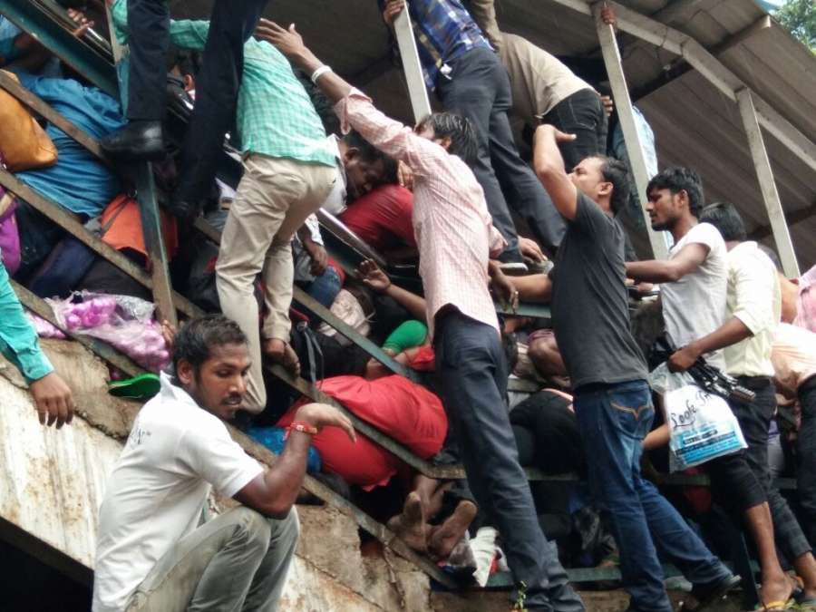 Mumbai: Stampede breaks out at on a narrow railway footover bridge connecting the Parel-Elphinstone Road stations of Western Railway in Mumbai on Sept 29, 2017. At least 22 commuters were killed. (Photo: IANS) by .