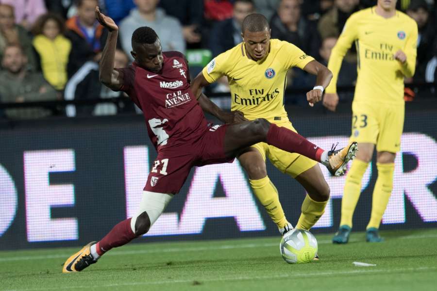 METZ, Sept. 9, 2017 (Xinhua) -- Kylian Mbappe (R) of Paris Saint Germain competes with Moussa Niakhate of Metz during their match of French Ligue 1 2017-2018 season 5th round in Metz, France on Sept. 8, 2017. Paris Saint Germain won 5-1. (Xinhua/Jack Chan/IANS) by .