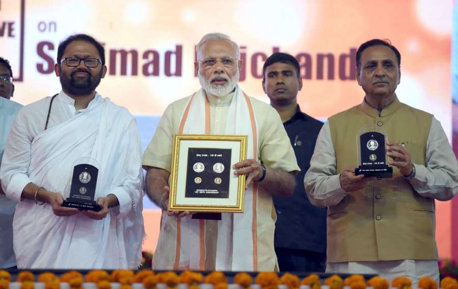 Ahmedabad: Prime Minister Narendra Modi releases commemorative coin on Shrimad Rajchandraji at Sabarmati Ashram in Ahmedabad on June 29, 2017. Also seen Gujarat Chief Minister Vijay Rupani. (Photo: IANS/PIB) by .