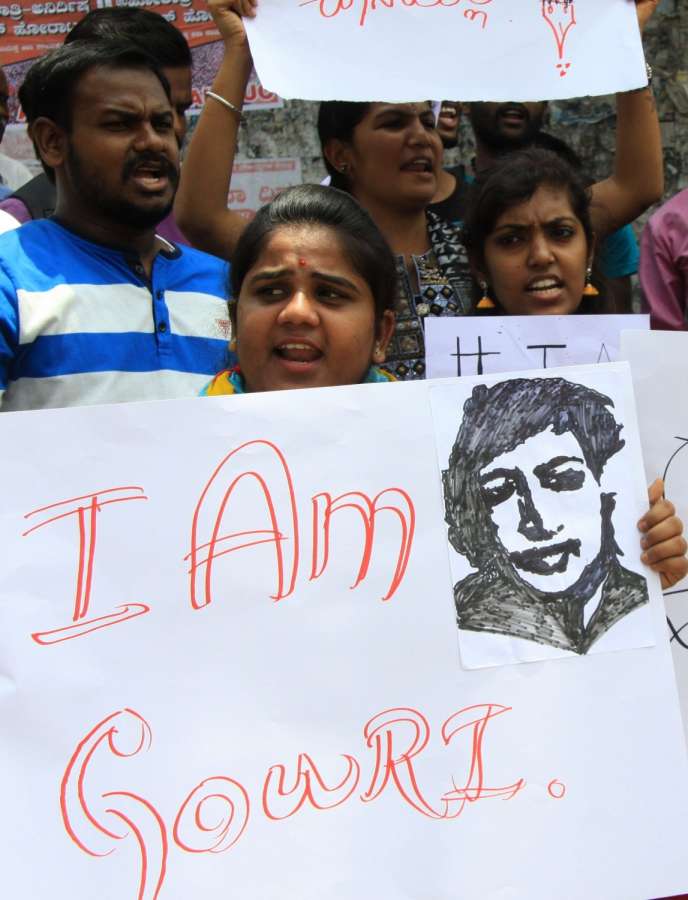 Bengaluru: People stage protest against senior journalist and activist Gauri Lankesh's murder in Bengaluru on Sept 6, 2017. Editor of the weekly Kannada tabloid "Lankesh Patrika", Lankesh was shot dead by unidentified men at her residence on Sept 5, 2017. (Photo: IANS) by .