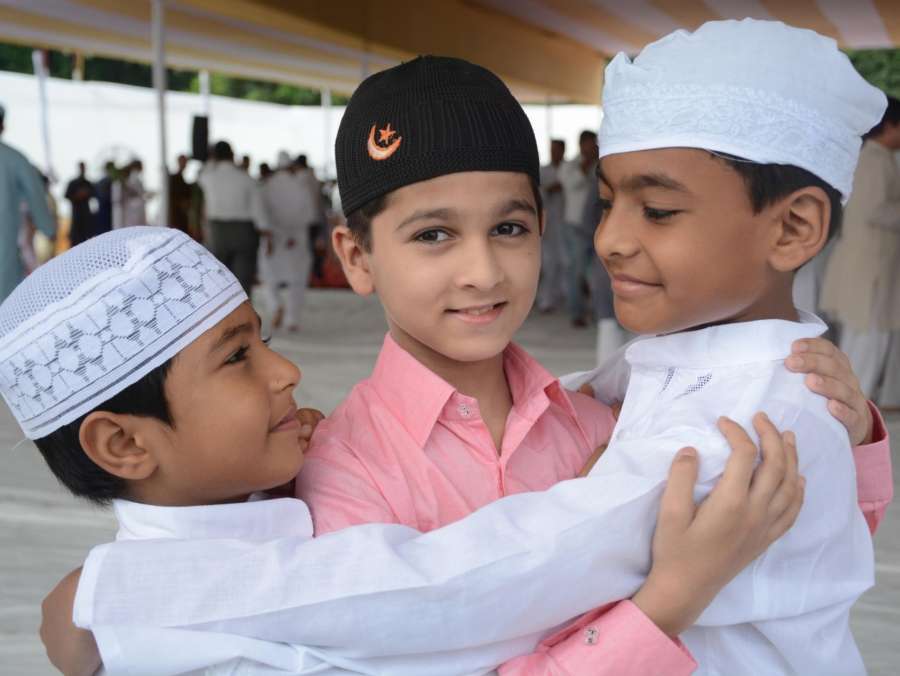 Lucknow: Children greet each other on Eid al-Adha in Lucknow on Sept 2, 2017. (Photo: IANS) by .