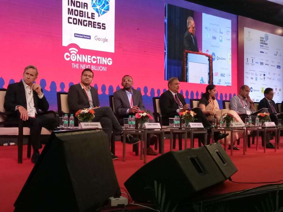 New Delhi: Qualcomm Executive Vice President and Qualcomm Technology Licensing President Alex Rogers, Flipkart co-founder Binny Bansal and Vodafone India MD and CEO Sunil Sood and Telecom Secretary Aruna Sundararajan during the "India Mobile Congress" organised by Department of Telecom in New Delhi on Sept 27, 2017. (Photo: Amlan Paliwal/IANS) by .