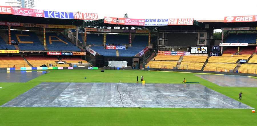 Bengaluru: Pitch being covered ahead of the fourth ODI match between India and Australia during rains at the M. Chinnaswamy Stadium in Bengaluru on Sept 27, 2017. (Photo: IANS) by .