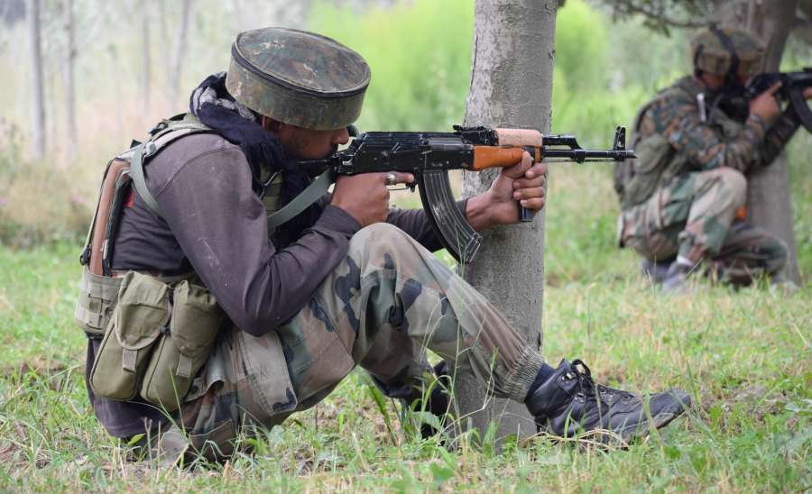 Pulwama: Soldiers take position during a gun fight between security forces and militants in which four people were killed in Jammu and Kashmir's Pulwama district on Aug. 26, 2017. The victims included a policeman, a Central Reserve Police Force (CRPF) head constable, a trooper and a militant. (Photo: IANS) by . 