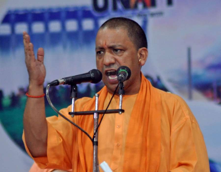 Surat: Uttar Pradesh Chief Minister Yogi Adityanath addresses during a public meeting near Surat on Oct 13, 2017. (Photo: IANS) by .
