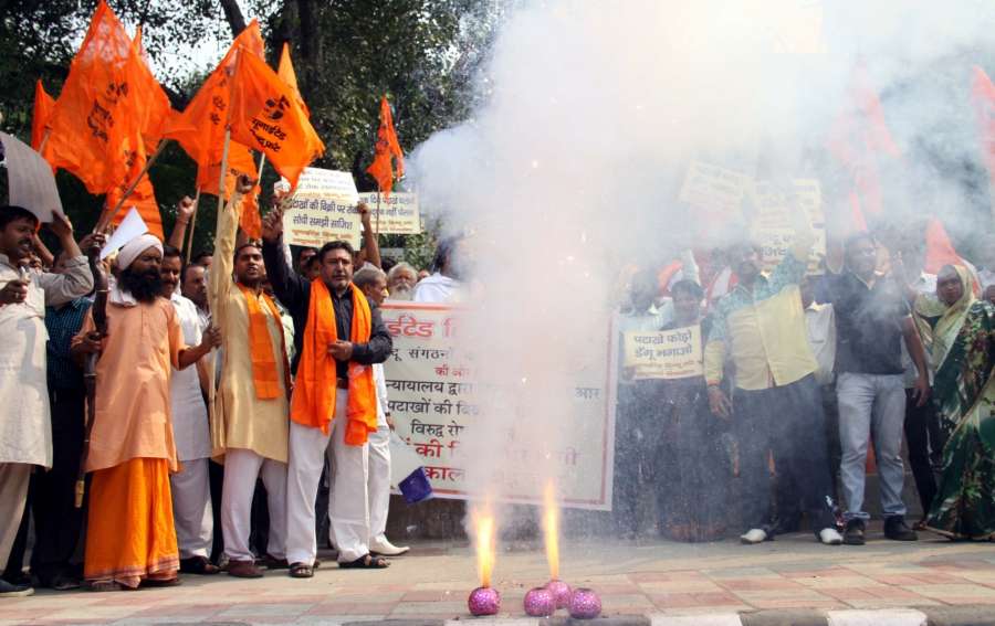 New Delhi: Right Wing Hindu activists stage a demonstration against Supreme Court's ban on the sale of fire crackers in Delhi and NCR this Diwali, in New Delhi, on Oct 13, 2017. The Supreme Court refused to modify its October 9 order banning the sale of fire crackers in Delhi and NCR this Diwali and expressed anguish that its order was being given a communal twist. (Photo: IANS) by .