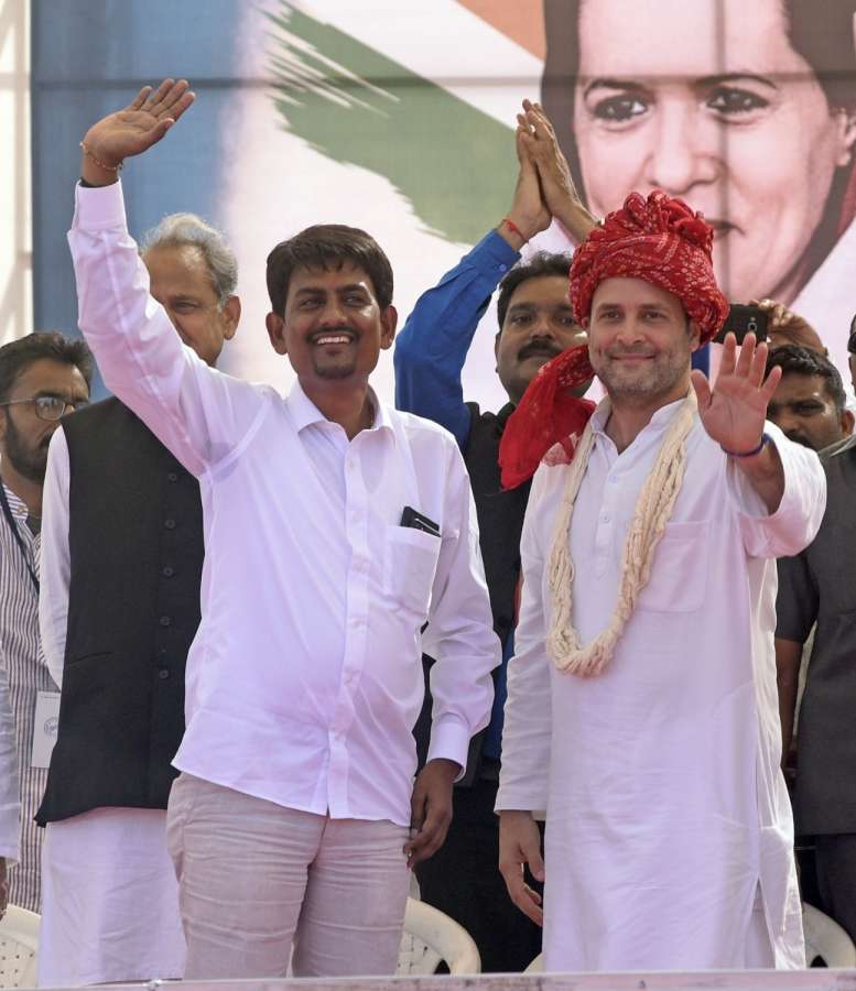 Gandhinagar: Congress Vice President Rahul Gandhi with Gujarat OBC leader Alpesh Thakore who joined the party during a public meeting in Gandhinagar on Oct 23, 2017. (Photo: IANS) by .