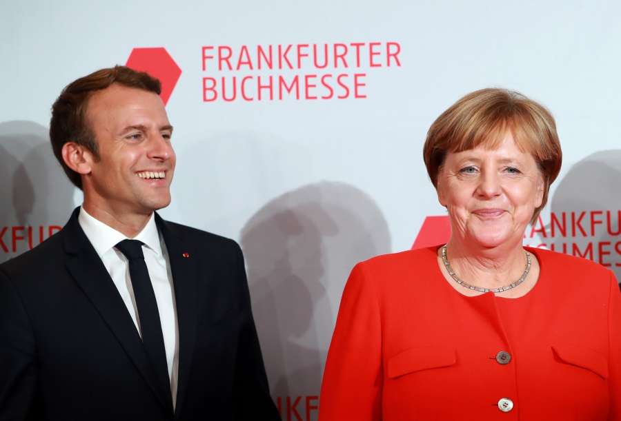 FRANKFURT, Oct. 10, 2017 (Xinhua) -- German Chancellor Angela Merkel (R) and French President Emmanuel Macron pose for photos as they arrive to open the 69th Frankfurt Book Fair in Frankfurt, Germany, on Oct. 10, 2017. German Chancellor Angela Merkel and French President Emmanuel Macron together opened the 69th Frankfurt Book Fair Tuesday evening. With around 200 French authors coming to Frankfurt, France is this year's guest of honor at the international publishing industry's biggest trade fair, where over 7,300 exhibitors from 102 countries and regions as well as around 278,000 visitors are expected. (Xinhua/Luo Huanhuan/IANS) by .