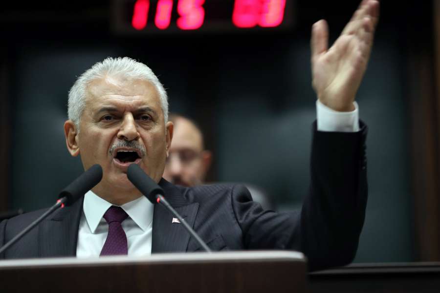 ANKARA, Oct. 10, 2017 (Xinhua) -- Turkish Prime Minister Binali Yildirim addresses the ruling Justice and Development Party (AKP)'s weekly parliamentary group meeting in Ankara, Turkey, on Oct. 10, 2017. Yildirim said on Tuesday that Turkey will not ask the United States for permission to detain or prosecute suspects. The spat between the two countries was ignited by the recent arrest of Metin Topuz, a U.S. consulate employee in Istanbul, over suspected links to U.S.-based Muslim cleric Fethullah Gulen, who is accused by Ankara of being behind a failed coup attempt in July 2016. (Xinhua/Mustafa Kaya/IANS) by .