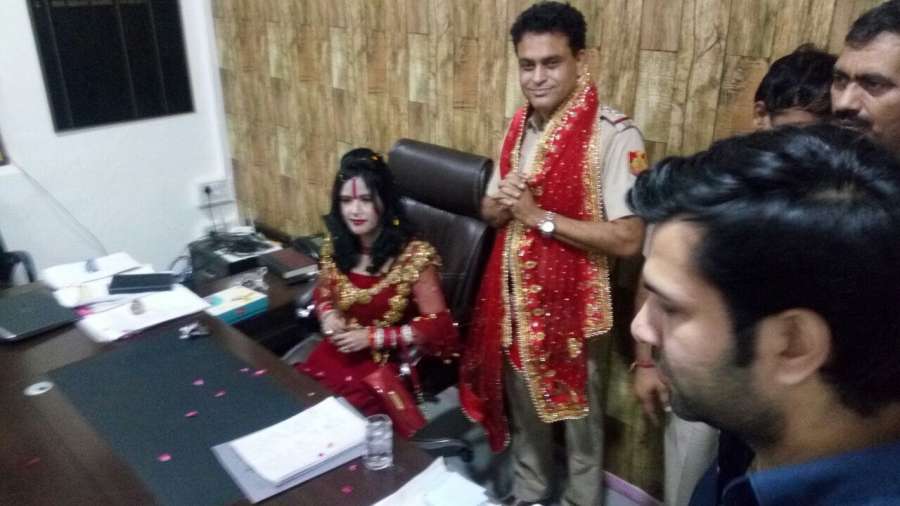 New Delhi: Self-styled godwoman Radhe Maa seated on the chair of Station House Officer (SHO) of Vivek Vihar police station in New Delhi on Oct 5, 2017. SHO Sanjay Sharma is seen standing next to her with folded hands. (Photo: IANS) by .