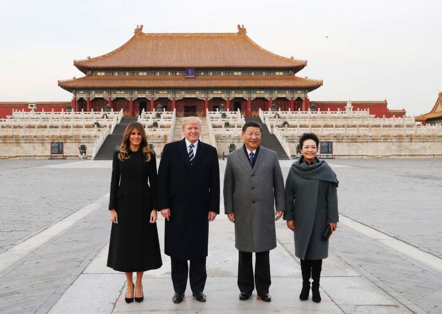 BEIJING, Nov. 8, 2017 (Xinhua) -- Chinese President Xi Jinping (2nd R) and his wife Peng Liyuan (1st R), and U.S. President Donald Trump (2nd L) and his wife Melania Trump pose for a photo in front of Taihedian, the Hall of Supreme Harmony, during their visit to the Palace Museum, or the Forbidden City, in Beijing, capital of China, Nov. 8, 2017. (Xinhua/Xie Huanchi/IANS) by . 