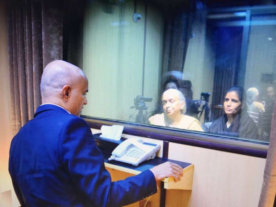 Islamabad: The mother and wife of Mumbai-based former naval officer-turned-businessman Kulbhushan Jadhav, who was arrested on March 3, 2016, and was sentenced to death by a Pakistani military court on charges of espionage and terrorism meet him at the Pakistan Foreign Office in Islamabad on Dec 25, 2017. The meeting, with the death row prisoner lasted for about 40 minutes, but with a glass panel separating them and spoke through a speaker phone. The meeting started at 2.18 p.m., according to the Foreign Office. Indian Deputy High Commissioner J.P. Singh, who accompanied Jadhav's family, was seen watching the reunion from a distance. (Photo: Twitter/@ForeignOfficePk) by . 