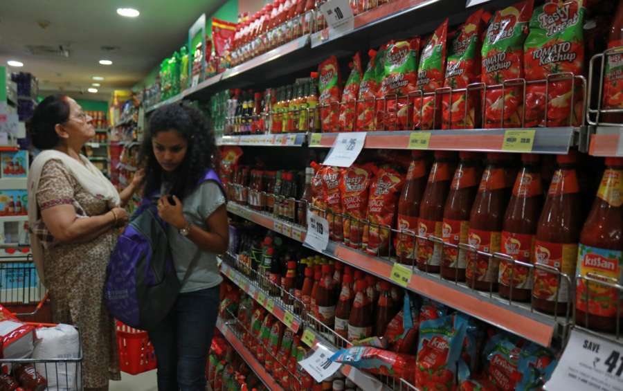 New Delhi: Shoppers rush at a supermarket after Goods and Services Tax (GST) roll out in New Delhi on July 1, 2017. (Photo: IANS) by .