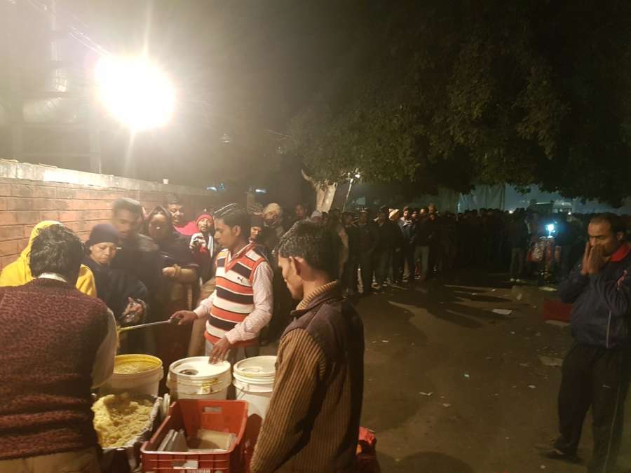 People queueing up at the PGI gate langar. by .