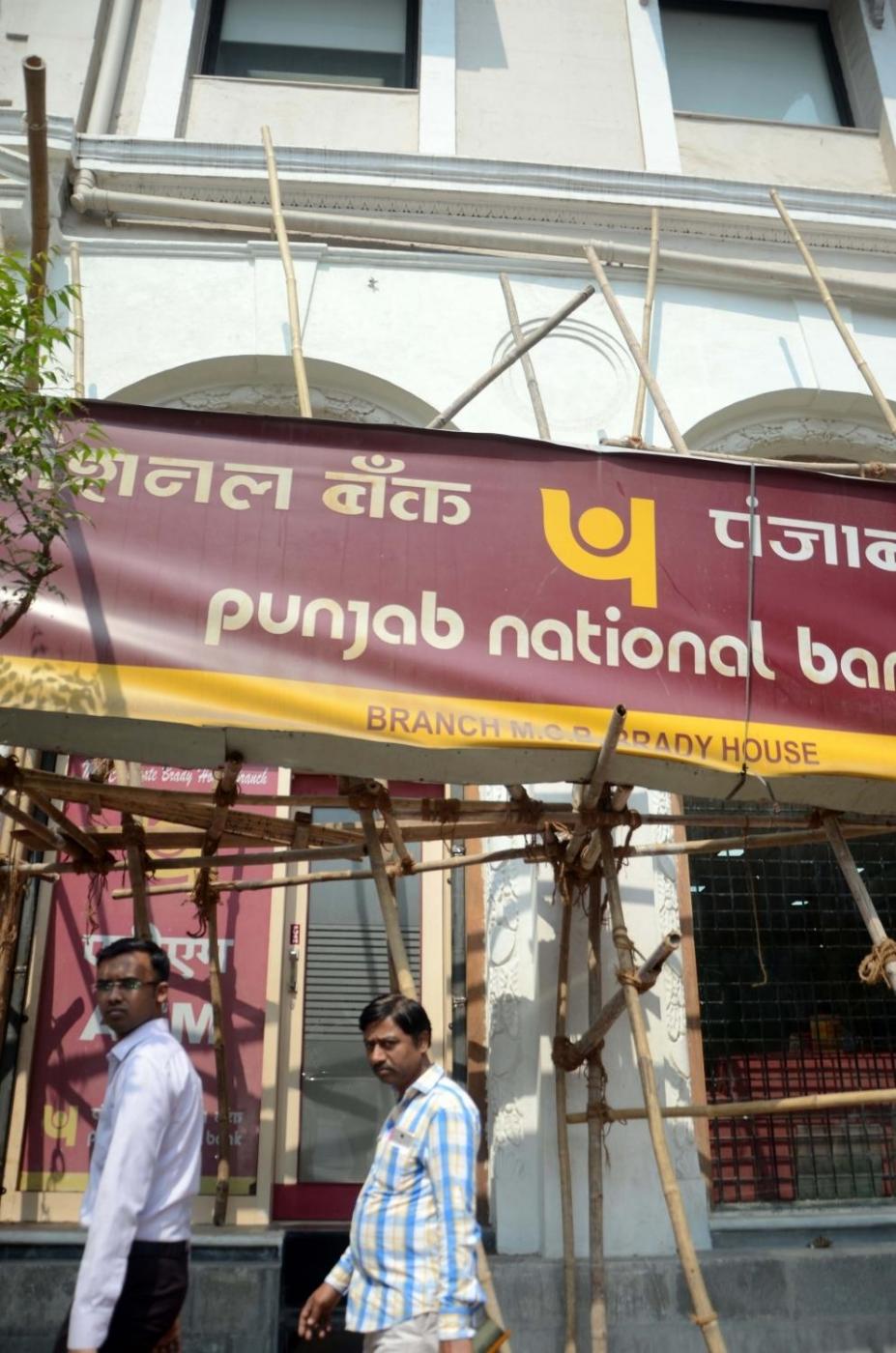 Mumbai: The Punjab National Bank's (PNB) Brady House branch where a massive $1.8 billion fraud was unearthed, in Mumbai on Feb 15, 2018. A day after a massive $1.8 billion fraud was unearthed in the flagship branch, the Enforcement Directorate launched a nationwide raid on billionaire diamond trader Nirav Modi the offices, showrooms and workshops.The multi-pronged action came a day after the Punjab National Bank admitted to unearthing a fraud of Rs 11,515 crore involving Modi's companies and certain other accounts with the bank's flagship branch (Brady House) in Mumbai and its second largest lending window in India.The fraud, which includes money-laundering among others, concerns the Firestar Diamonds group in which the CBI last week booked Modi, his wife Ami, brother Nishal and a maternal uncle Mehul Choksi.It is learnt that Modi - whose operations are spread across Europe, the US, Middle East and Far East besides India - has written to PNB and other banks that he would return their outstandings. (Photo: Sandeep Mahankal/IANS) by . 