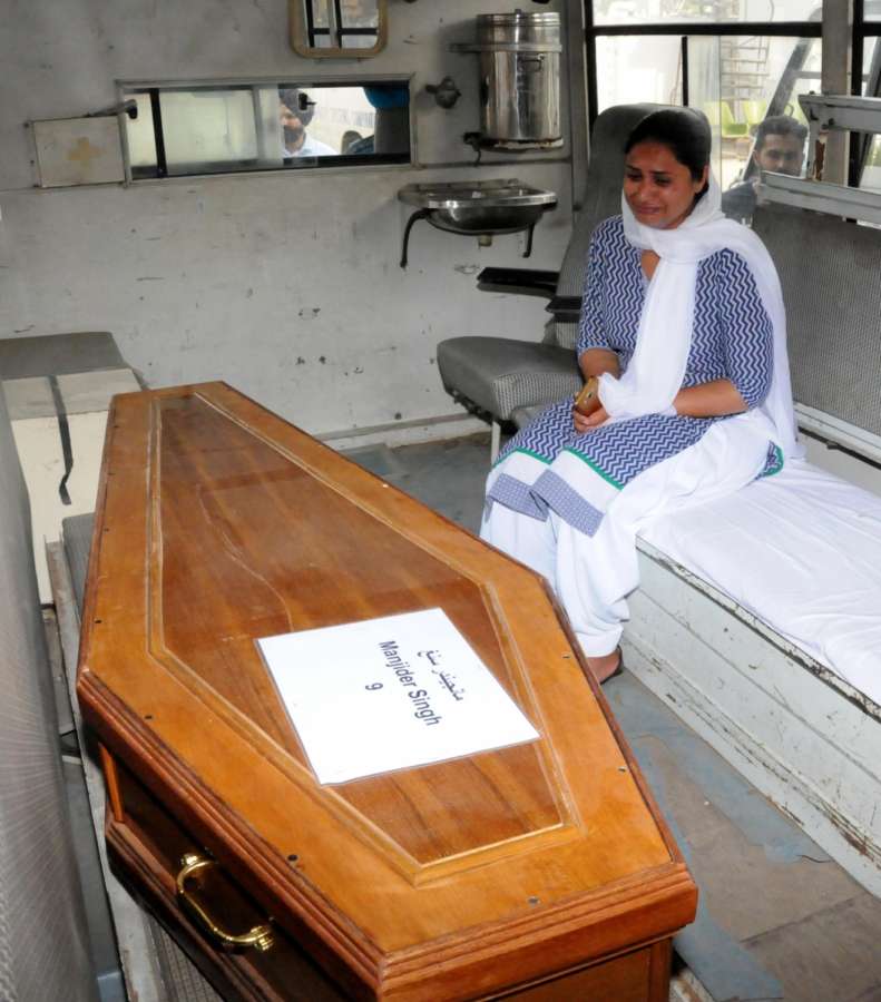 Amritsar: Coffin of one of the 39 Indian men killed by the Islamic State in Iraq's Mosul in 2014 arrives in Amritsar on April 2, 2018. Although 39 Indians were killed as the Islamic State took over Mosul, the mortal remains of 38 were brought back as the identification of one body is still pending. (Photo: IANS) by . 
