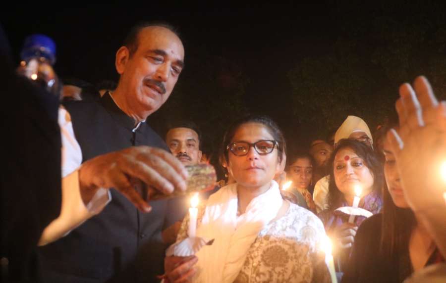 New Delhi: Congress leaders Ghulam Nabi Azad and Sushmita Dev participate in a candlelight vigil called by party president Rahul Gandhi to protest against incidents of rape in Unnao (Uttar Pradesh) and Kathua (Jammu and Kashmir) at India Gate in New Delhi on April 12, 2018. (Photo: Bidesh Manna/IANS) by . 