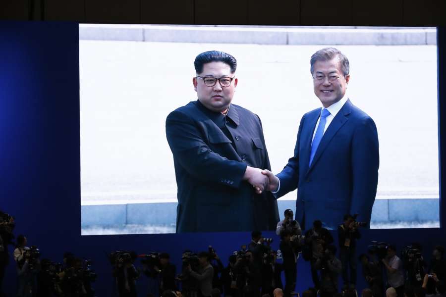 GOYANG (South Korea), April 27, 2018 (Xinhua) -- Photo taken on April 27, 2018 at the media center in Goyang, South Korea, shows a screen broadcasting South Korean President Moon Jae-in (R) shaking hands with top leader of the Democratic People's Republic of Korea (DPRK) Kim Jong Un in the border village of Panmunjom. Moon Jae-in arrived Friday morning in the border village of Panmunjom for his first summit with Kim Jong Un. (Xinhua/Wang Jingqiang/IANS) by .
