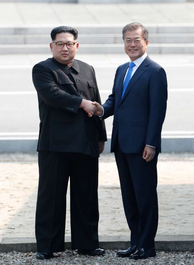 PANMUNJOM, April 27, 2018 (Xinhua) -- South Korean President Moon Jae-in (R) shakes hands with top leader of the Democratic People's Republic of Korea (DPRK) Kim Jong Un in the border village of Panmunjom on April 27, 2018. Moon Jae-in arrived Friday morning in the border village of Panmunjom for his first summit with Kim Jong Un. (Xinhua/Inter-Korean Summit Press Corps/IANS) by . 