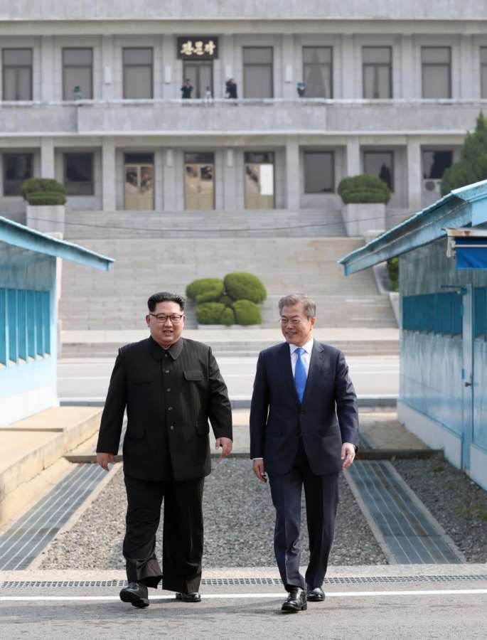 Panmunjom: South Korean President Moon Jae-in (R) and North Korean leader Kim Jong-un head to a summit site at the truce village of Panmunjom on April 27, 2018.(Yonhap/IANS) by .