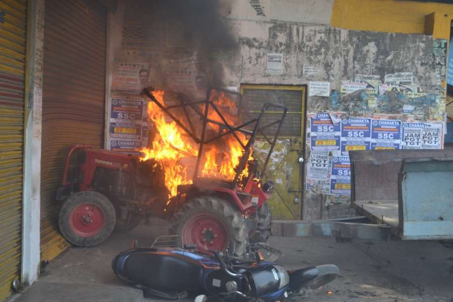 Meerut: A tractor set ablaze by protesters during a nation wide strike called to protest against the dilution of the SC/ST Prevention of Atrocities Act in Meerut, on April 2, 2018. (Photo: IANS) by . 
