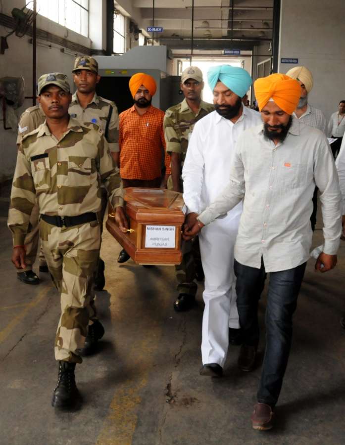 Amritsar: Coffin of one of the 39 Indian men killed by the Islamic State in Iraq's Mosul in 2014 arrives in Amritsar on April 2, 2018. Although 39 Indians were killed as the Islamic State took over Mosul, the mortal remains of 38 were brought back as the identification of one body is still pending. (Photo: IANS) by . 