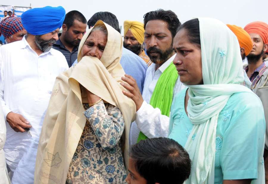 Amritsar: Grief struck family members of the Indian men killed by the Islamic State in Iraq's Mosul after coffins of the 38 Indian men killed by the Islamic State in Iraq's Mosul in 2014 were brought to India; in Amritsar on April 2, 2018. Although 39 Indians were killed as the Islamic State took over Mosul, the mortal remains of 38 were brought back as the identification of one body is still pending. (Photo: IANS) by . 
