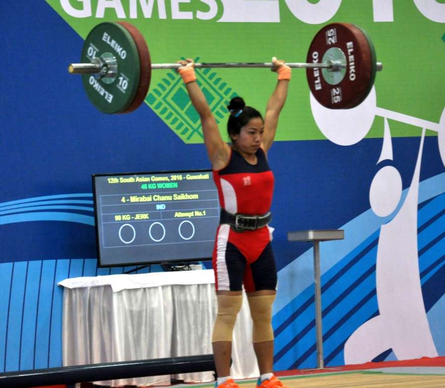 Guwahati: Indian weightlifter Mirabai Chanu Saikhom in action and win the gold medal in the women`s weightlifting, at 12th South Asian Games, in Guwahati on Feb. 6, 2016. (Photo: IANS/PIB) by . 