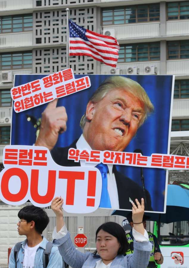 Seoul: A protester holds a banner that says, "Trump jeopardizes peace on the Korean Peninsula," during a rally in front of the U.S. Embassy in Seoul on May 25, 2018, to criticize the U.S. government and call for a summit with North Korea as scheduled. On May 24, U.S. President Donald Trump called off his meeting with North Korean leader Kim Jong-un scheduled for June 12, citing the North's "tremendous anger and open hostility."(Yonhap/IANS) by . 