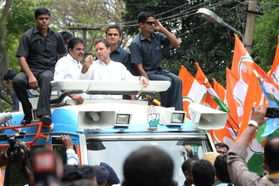 Bengaluru: Congress President Rahul Gandhi during a roadshow ahead of Karnataka Assembly polls in Bengaluru, on May 9, 2018. (Photo: IANS) by . 