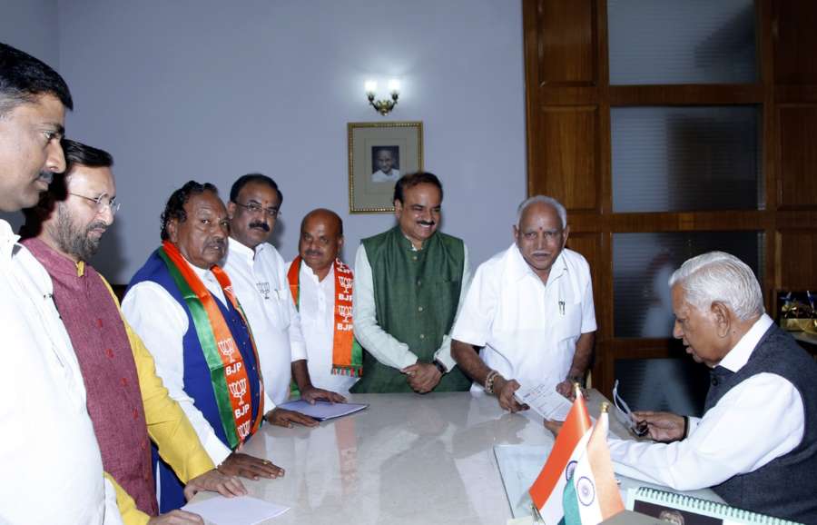 Bengaluru: BJP's chief ministerial candidate in Karnataka B. S. Yeddyurappa along with party leaders Ananth Kumar, Prakash Javadekar and Muralidhar Rao, meets Karnataka Governor Vajubhai Vala to stake claim to form the government though the party is eight seats short of a majority in the Assembly; in Bengaluru on May 16, 2018. (Photo: IANS) by . 