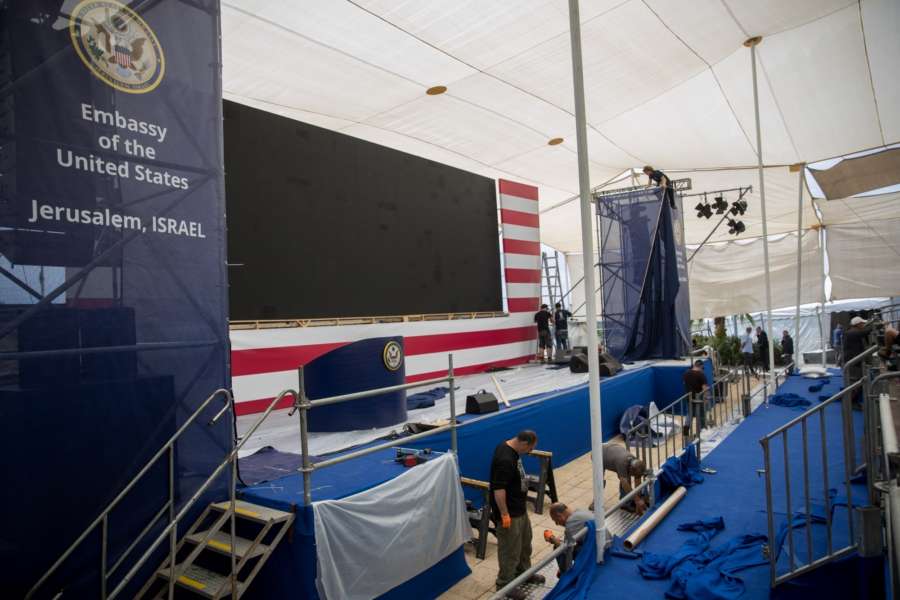 JERUSALEM, May 13, 2018 (Xinhua) -- Workers prepare the stage for the opening ceremony of the new U.S. embassy in Jerusalem on May 13, 2018. Israel prepares on Sunday for the opening ceremony of the new U.S. embassy in Jerusalem on Monday, a move that has sparked Palestinian protests. (Xinhua/JINI/IANS) by . 