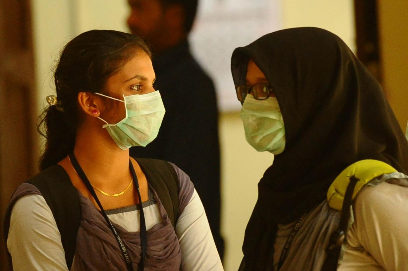 Kozhikode (Kerala): Students wear safety masks as a precautionary measure after the outbreak of 'Nipah' virus in Kozhikode, Kerala on May 22, 2018. (Photo: IANS) by . 