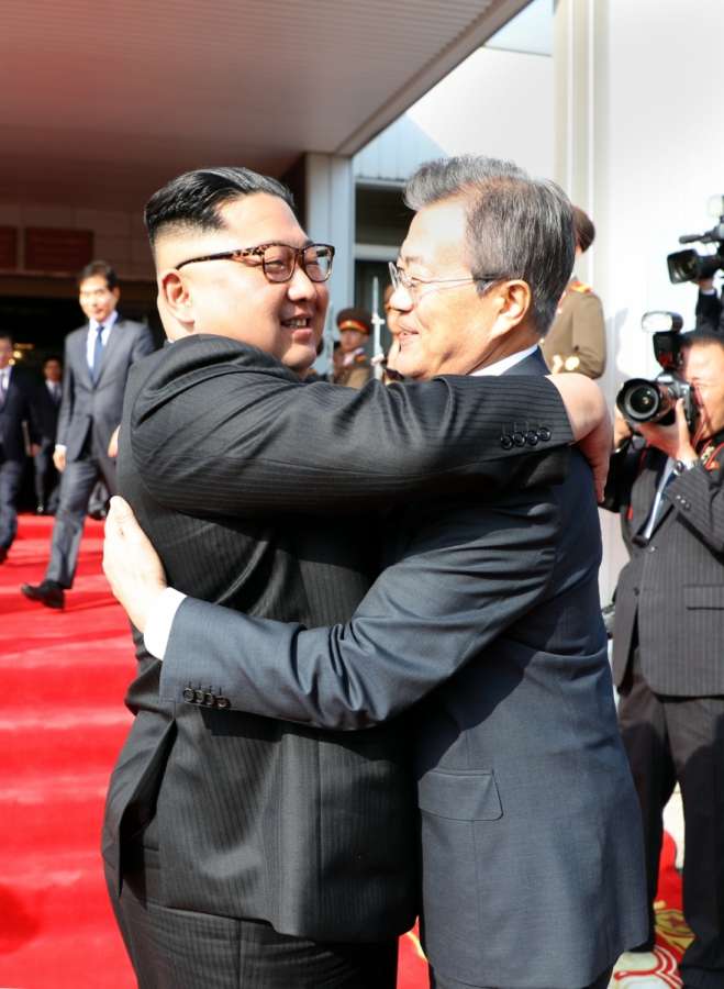 Panmunjom: In this photo provided by Cheong Wa Dae, North Korean leader Kim Jong-un (L) hugs South Korean President Moon Jae-in after their summit at Tongilgak on the northern side of Panmunjom in the Demilitarized Zone on May 26, 2018.(Yonhap/IANS) by . 