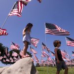 MALIBU, Sept. 11, 2018 (Xinhua) -- Children play among U.S. national flags erected to honor the victims of the September 11, 2001 attacks in New York, at the campus of Pepperdine University in Malibu, the United States, Sept. 10, 2018. (Xinhua/Zhao Hanrong/IANS) by . 