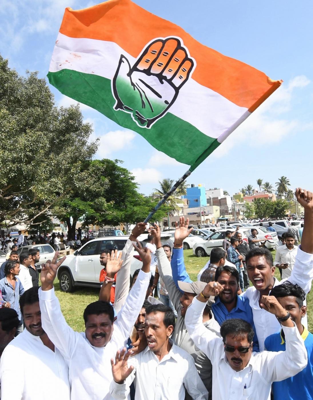 Mysuru: Congress workers celebrate the party's performance in the polls conducted for 105 Urban Local Bodies (ULBs) across Karnataka, outside a counting center in Mysuru on Sept 3, 2018. (Photo: IANS) by . 