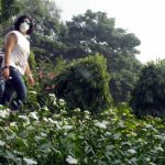 New Delhi: A girls wears a mask to protect herself from pollution as smog engulfs Delhi, on Oct 30, 2018. (Photo: IANS) by .