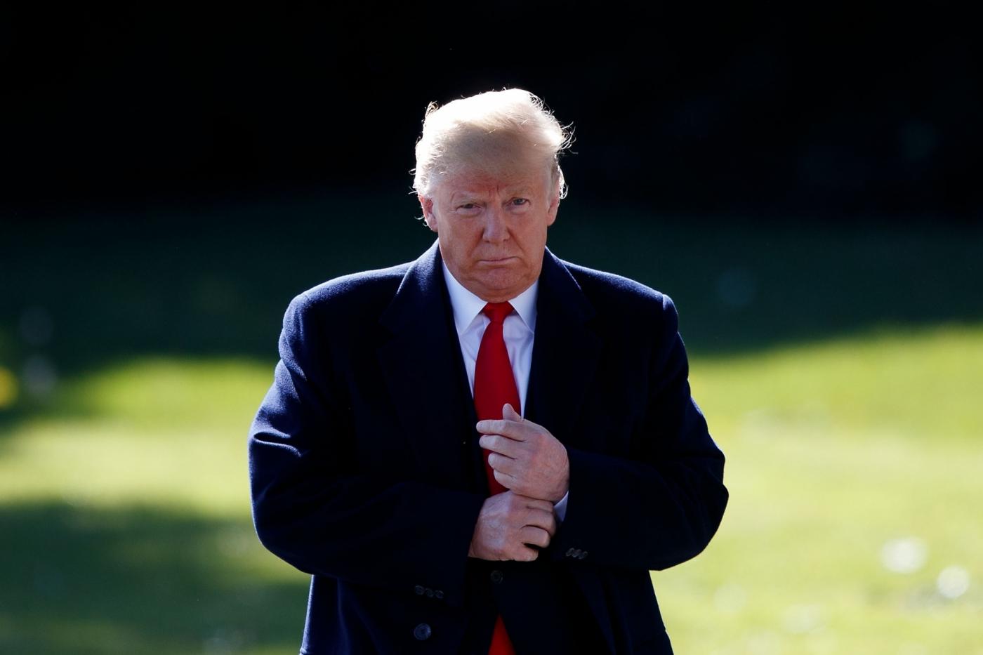 WASHINGTON, Oct. 22, 2018 (Xinhua) -- U.S. President Donald Trump speaks to reporters before departing from the White House in Washington D.C., the United States, on Oct. 22, 2018. Donald Trump said on Monday that his country will begin cutting off or reducing aid to three countries in Central America, citing migrant caravan heading to the U.S. border. (Xinhua/Ting Shen/IANS) by . 
