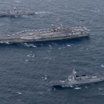 The USS Ronald Reagan aircraft carrier (C) conducts a drill with South Korean and U.S. warships in the East Sea on Oct. 18, 2017, in this photo provided by the U.S. Navy. (Yonhap/IANS) by . 